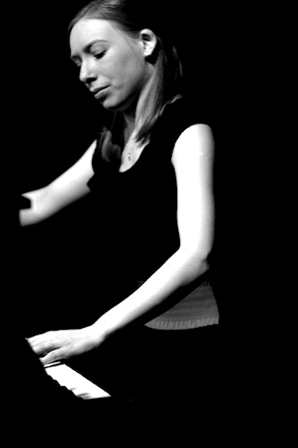 Gemma Hawkins when younger at the piano